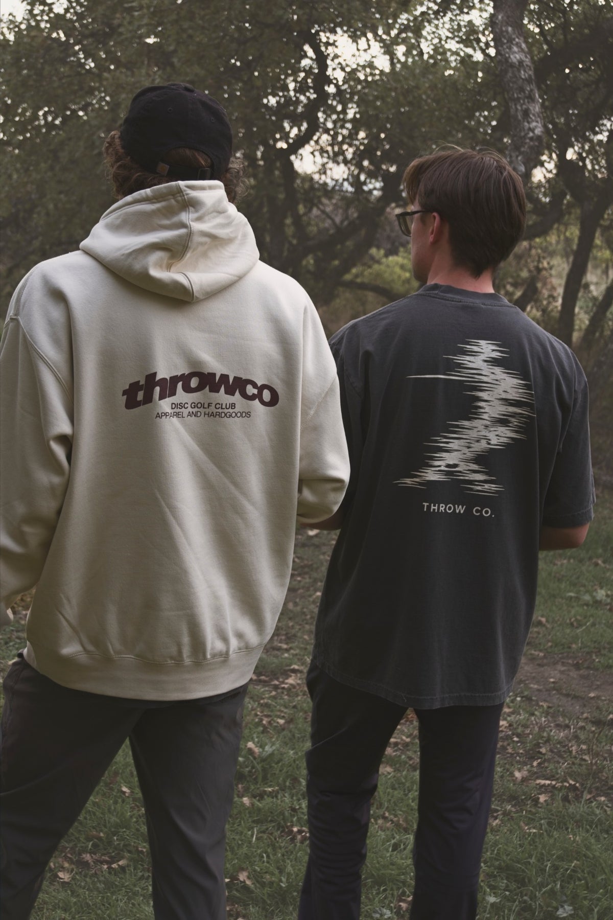 The Classic Throw Co. Hoodie in Off White and the Classic Throw Co. Tee in Slate Grey, back prints