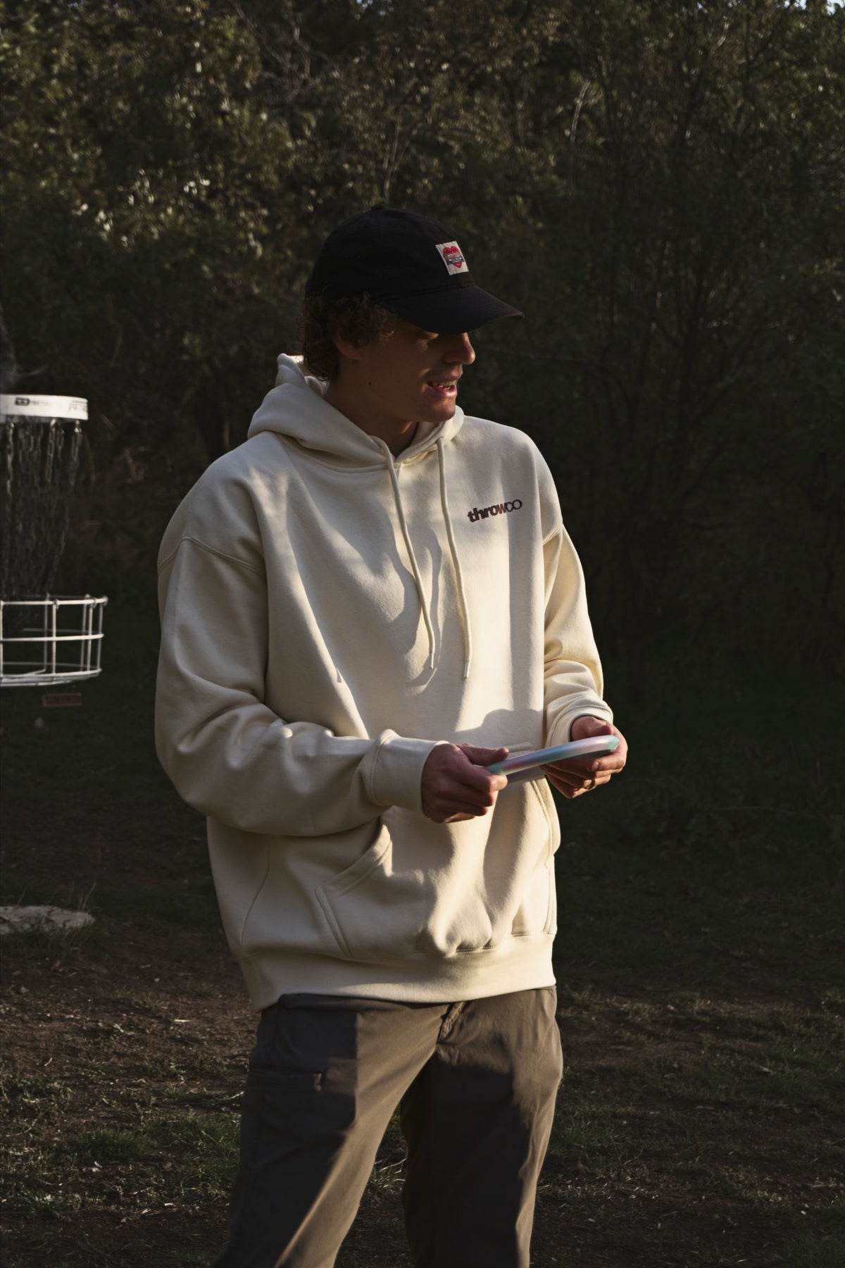 The Classic Throw Co. Hoodie in Off White, front chest logo