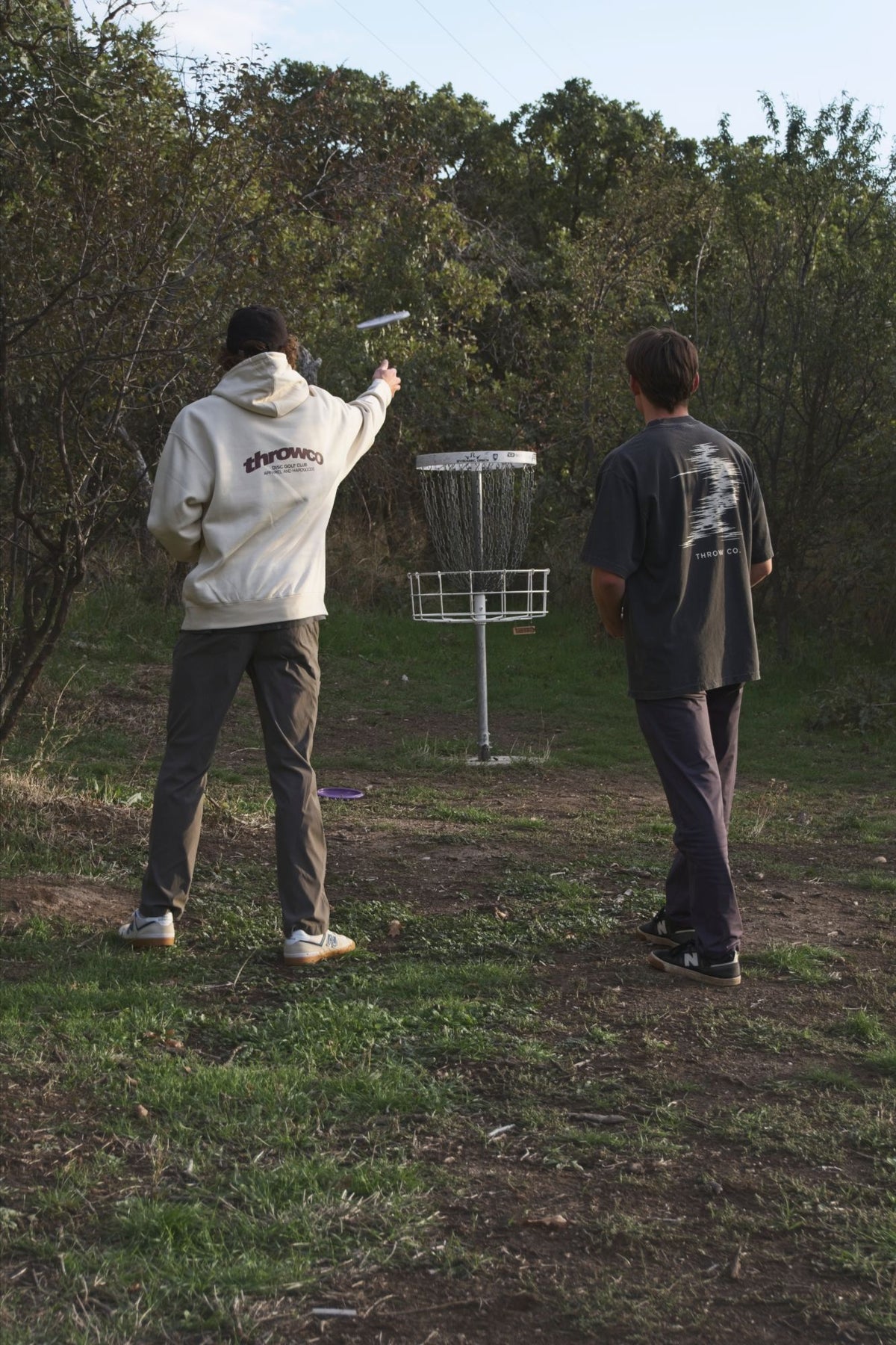 The Classic Throw Co. Hoodie in Off White, putting at the basket